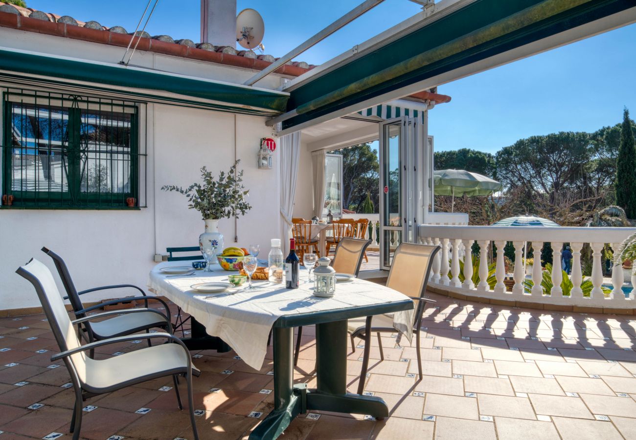 Large outdoor terrace with barbecue in family house in l'Escala