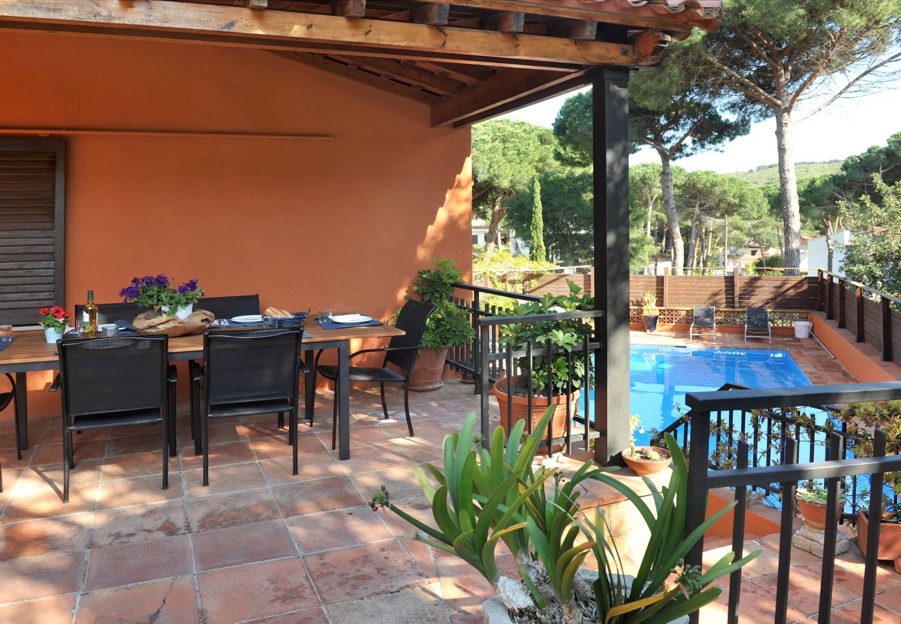 Large outdoor terrace with swimming pool in l'Escala